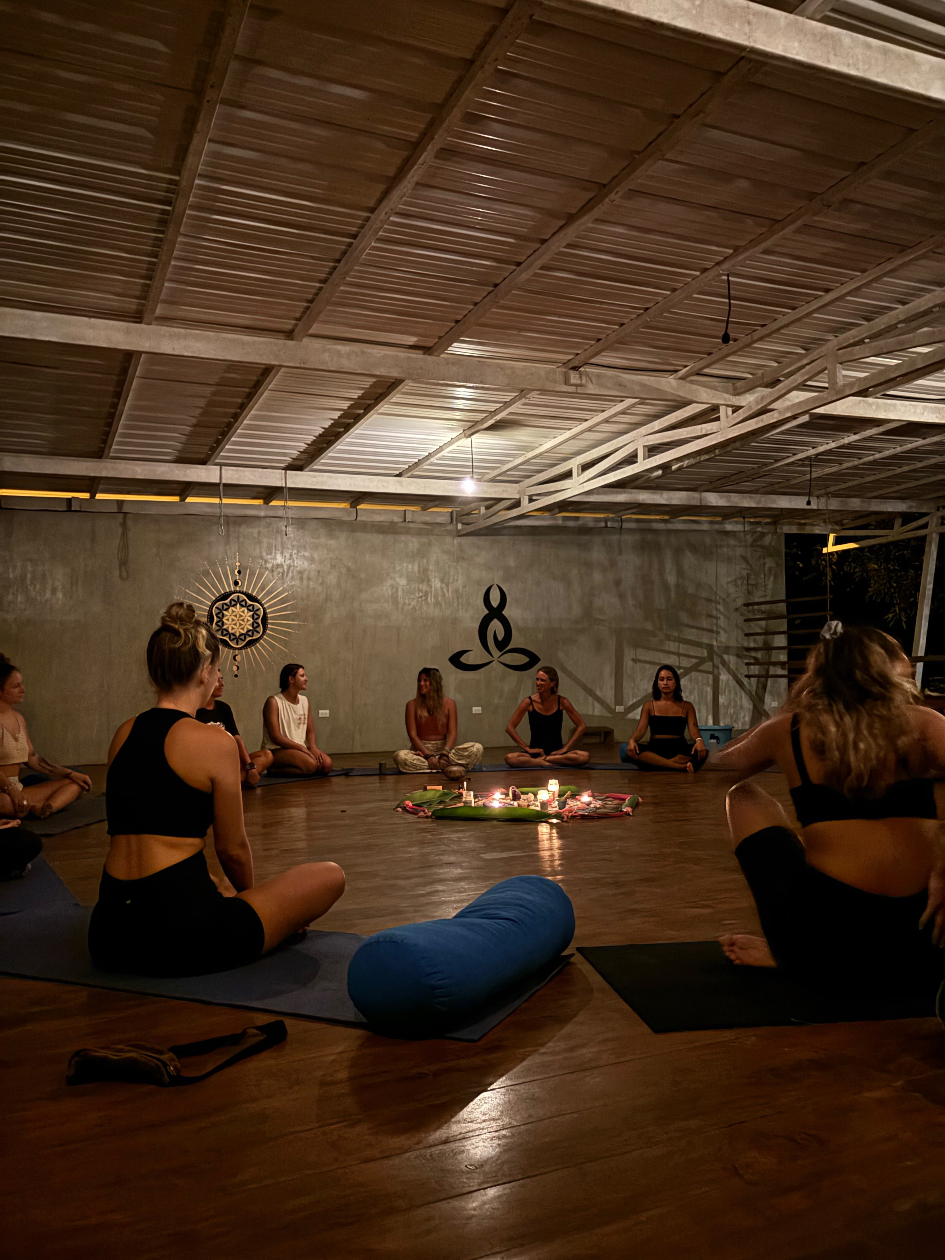 Women in meditation circle during ceremony